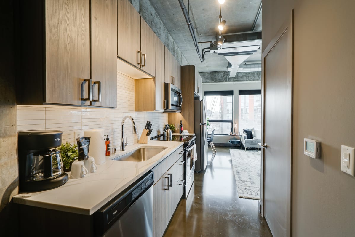 Your sleek modern kitchen features premium appliances and ample counter space for preparing memorable meals during your stay.
