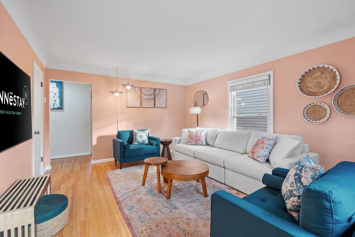 Sink into plush seating surrounded by warm coral walls and thoughtful decor that creates your perfect retreat for relaxation.
