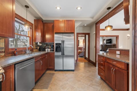 Contemporary kitchen with wooden cabinets and stainless steel appliances
