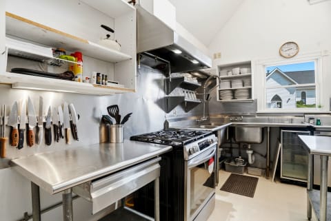 Professional-grade kitchen where you'll create memorable meals with stainless steel appliances, gas range, and abundant prep space. Bright natural light and thoughtful organization make cooking a joy.