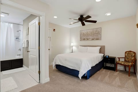 Step into your serene bedroom retreat where crisp linens await and soft carpet cushions each step. The ceiling fan promises comfort while the ensuite beckons for leisurely mornings.