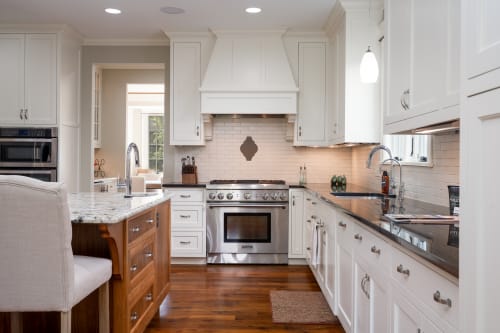 Step into your fully equipped gourmet kitchen with marble countertops, stainless steel appliances, and warm wood flooring - perfect for creating memorable meals.