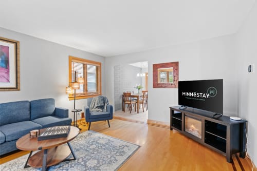 Unwind in your stylish living room with cozy seating and modern entertainment center for perfect evenings in.