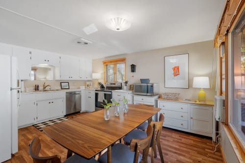 Your spacious kitchen features warm wood tones and modern appliances, perfect for preparing memorable meals together.