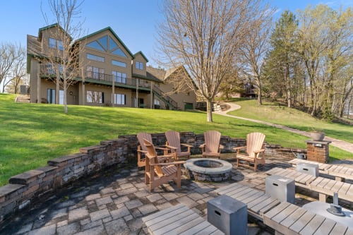 Gather around your private fire pit surrounded by Adirondack chairs and stone walls, perfect for evening conversations under the stars.