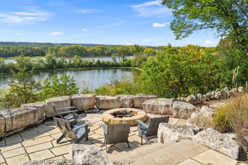 Gather around your private fire pit as evening falls, sharing stories while gazing across the tranquil lake waters.