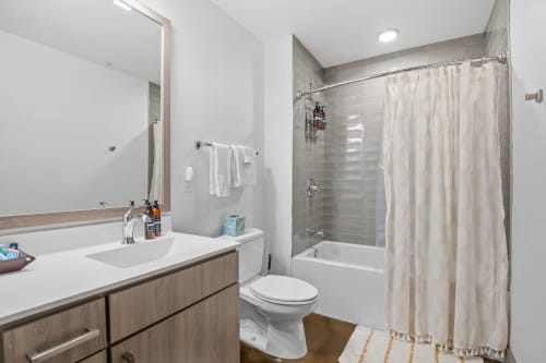 Refresh in your modern bathroom with a luxurious soaking tub, spacious vanity, and sleek finishes throughout.