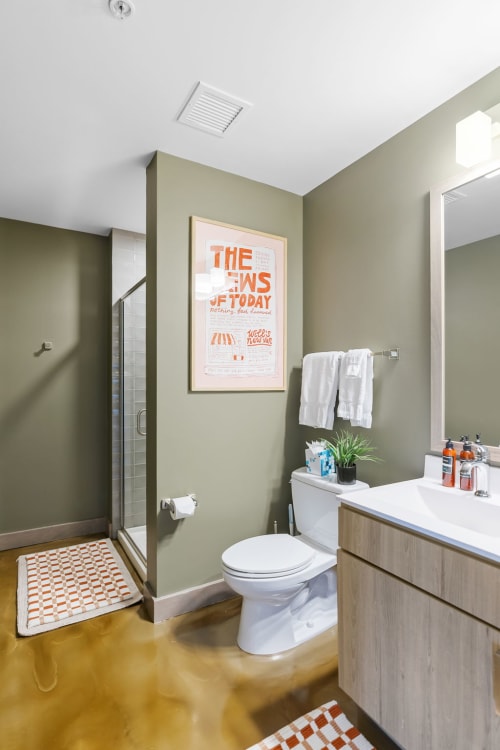 Your stylish bathroom features modern finishes, soft lighting, and thoughtful touches like fresh towels and plants to help you feel right at home.