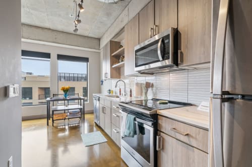 Cook your favorite meals in this sleek modern kitchen with stainless appliances and plenty of counter space for prep.