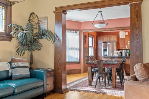 Step into your inviting open-concept living space where rich wood details and warm colors create the perfect backdrop for memorable gatherings.